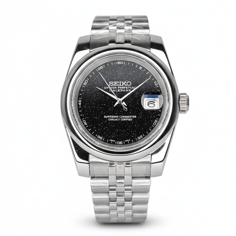 Seiko watch with black dial and silver metal strap on a white background